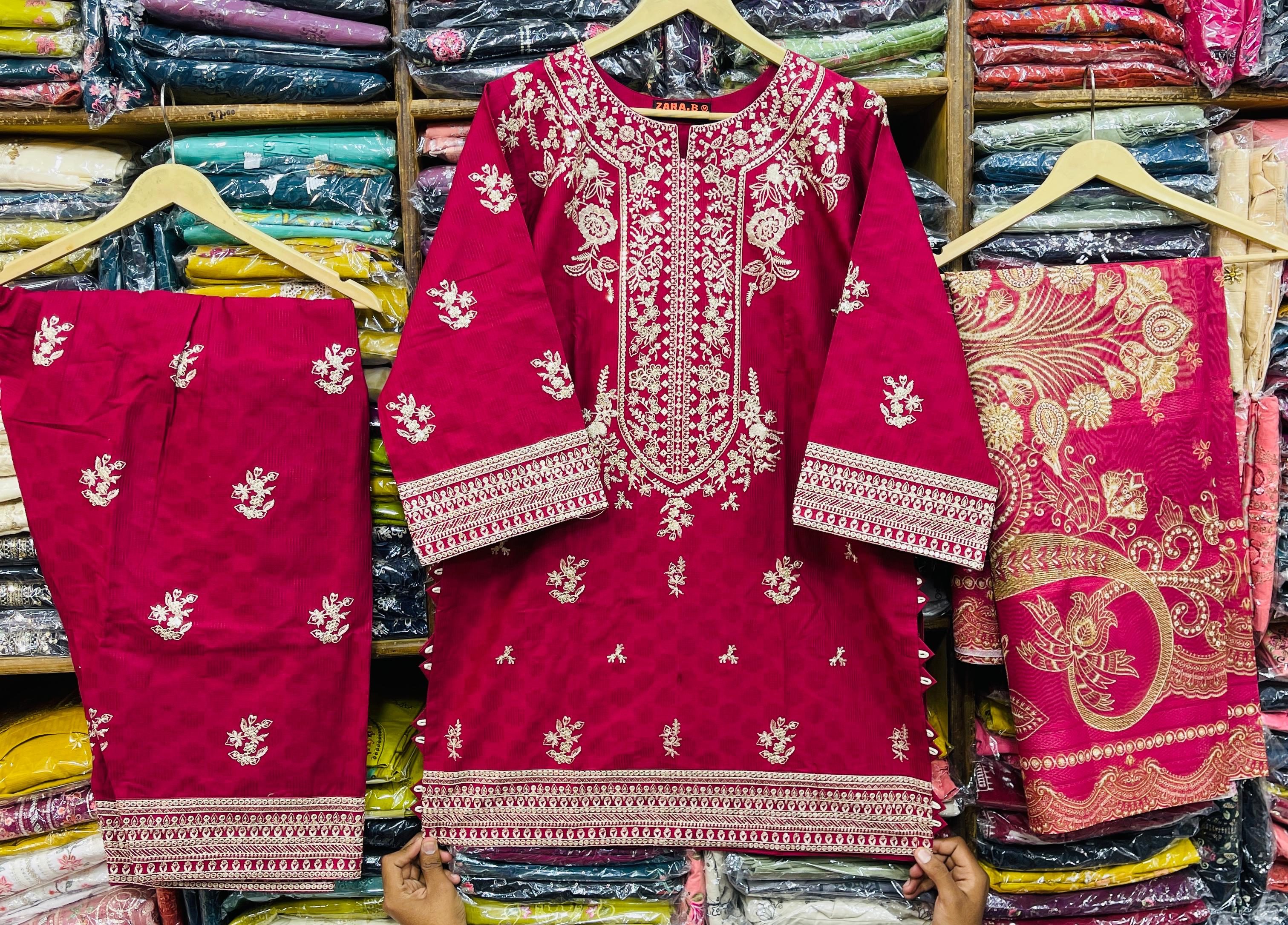 Graceful Magenta Luxury Suit with Intricate Cream Embroidery